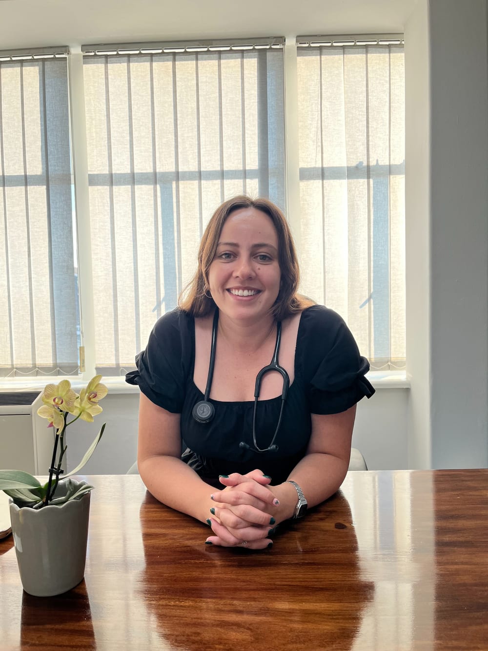 Dr Olivia Visentin, General Practitioner, smiling at her desk
