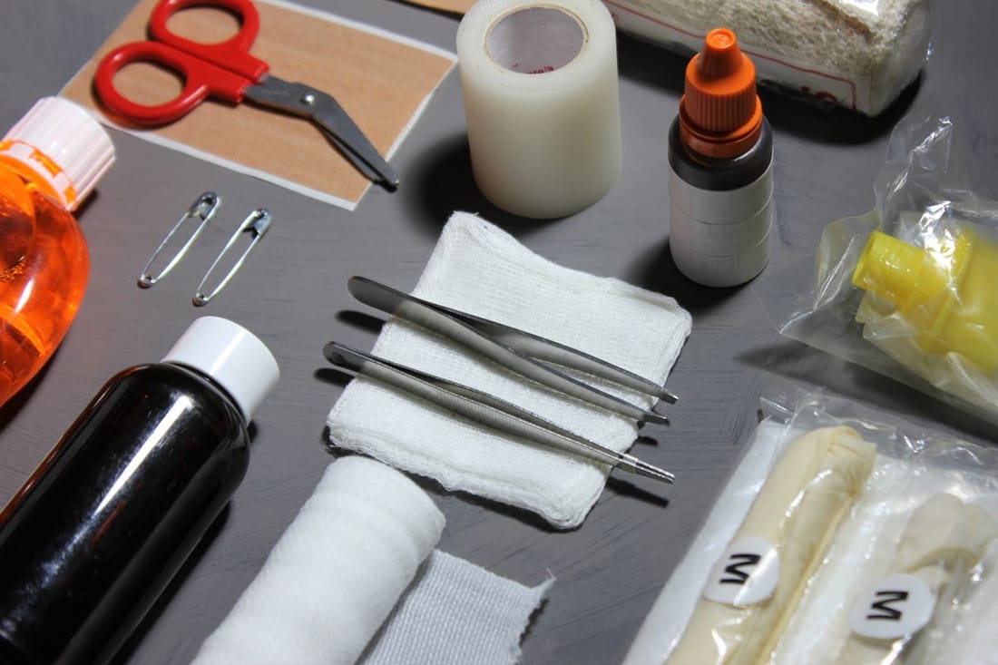 Wound care and suturing supplies laid out for a minor procedure