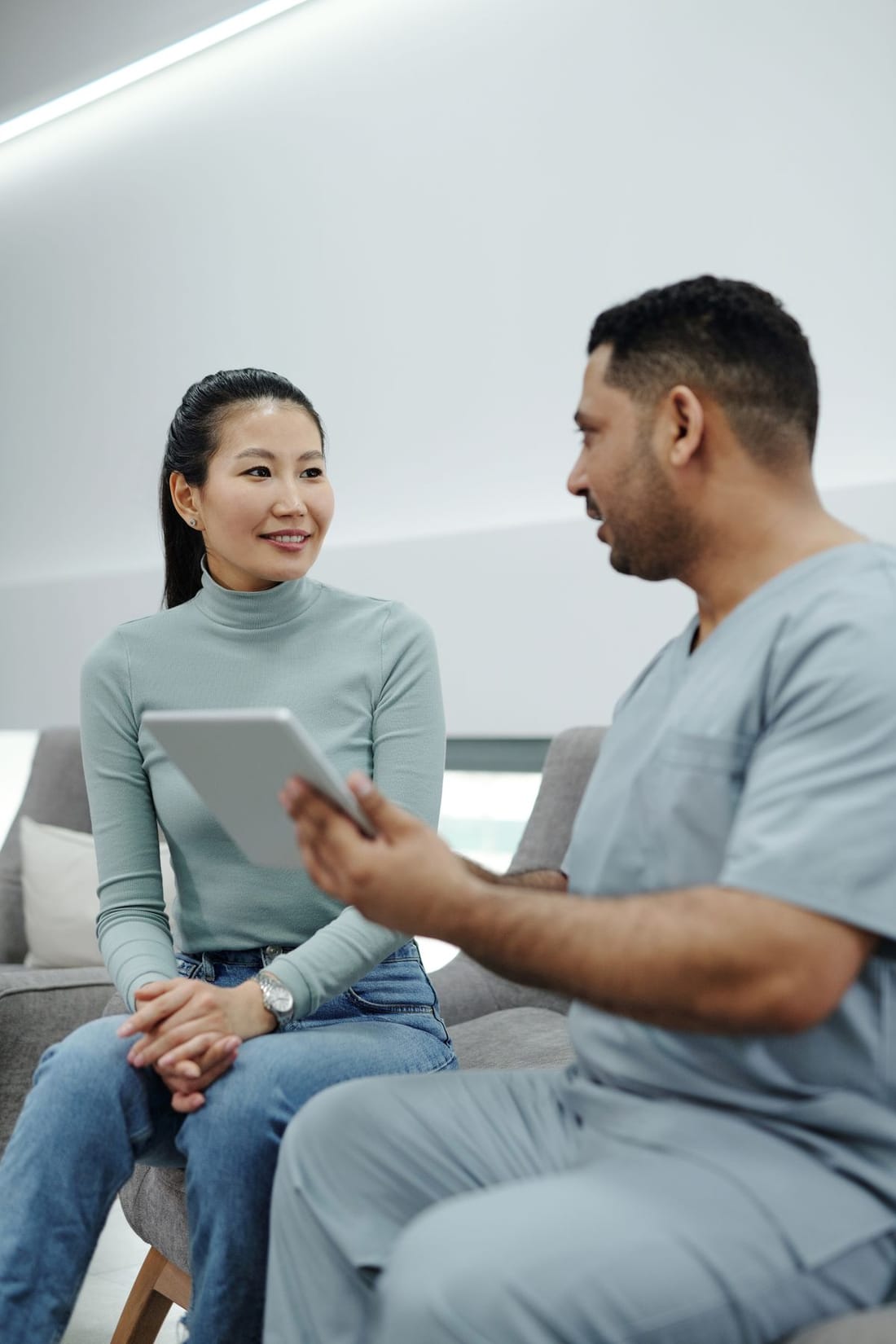 Doctor consulting with a female patient, representing women's health services